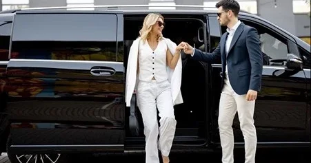 A couple arriving at a private event in New York in a luxury black van