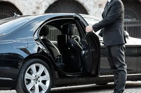 Suited Chauffeur Opening Door of Black Car, RNR