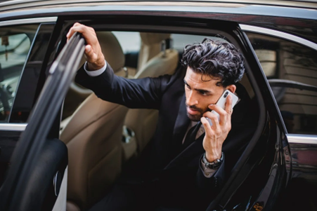 Man with Mobile in Corporate Car, RNR